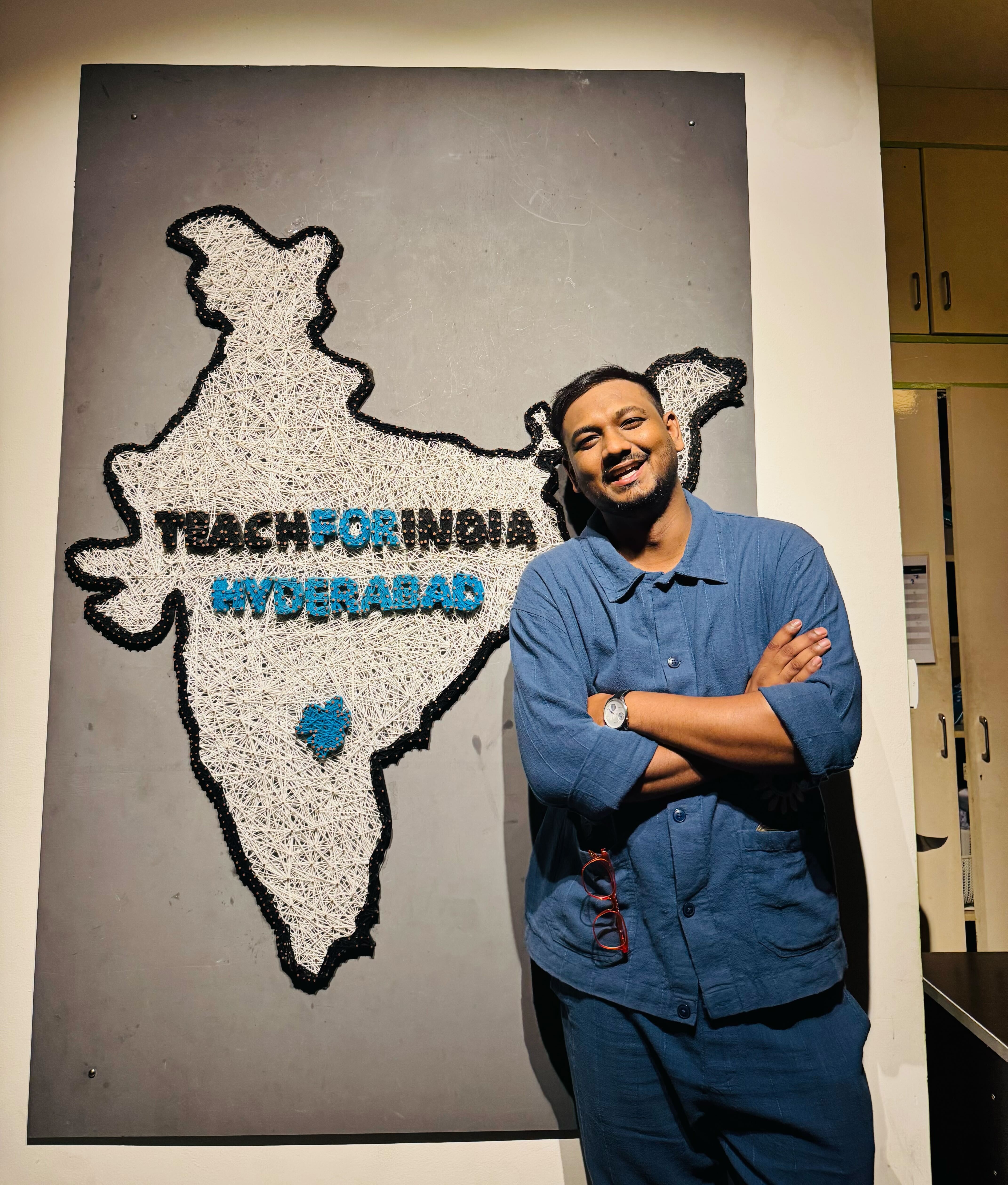 Saketh in front of Teach for India banner