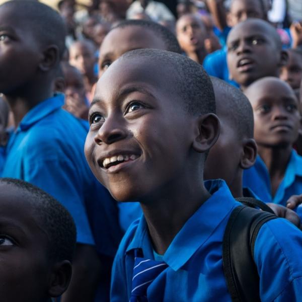 Image of a child in Kenya looking off at something out of frame to the left