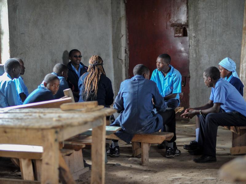Students in a circle having a discussion, Kenya