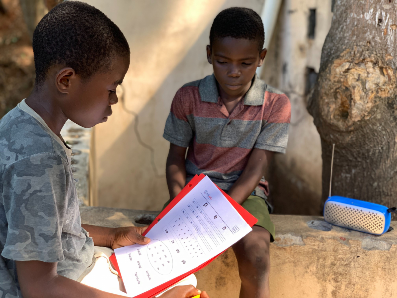 Students listening to Read Haiti/Strong Beginnings Radio Program