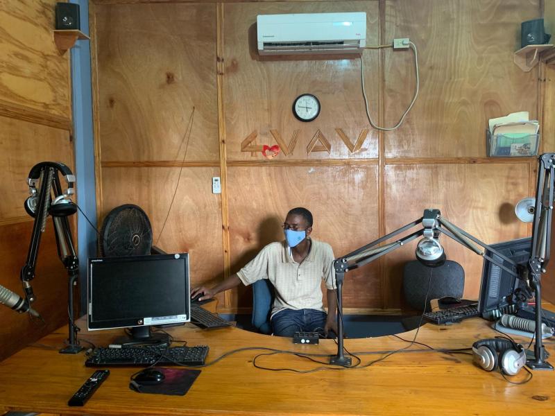 Radio Operator at desk with mask