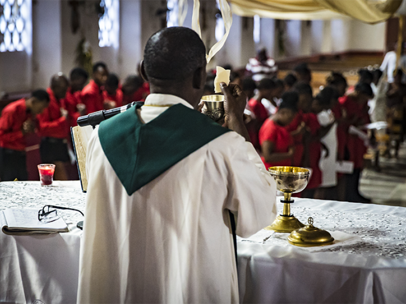 Priest at front of congregation